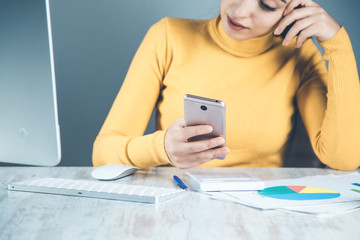 Wall Mural - woman working in phone with computer in office