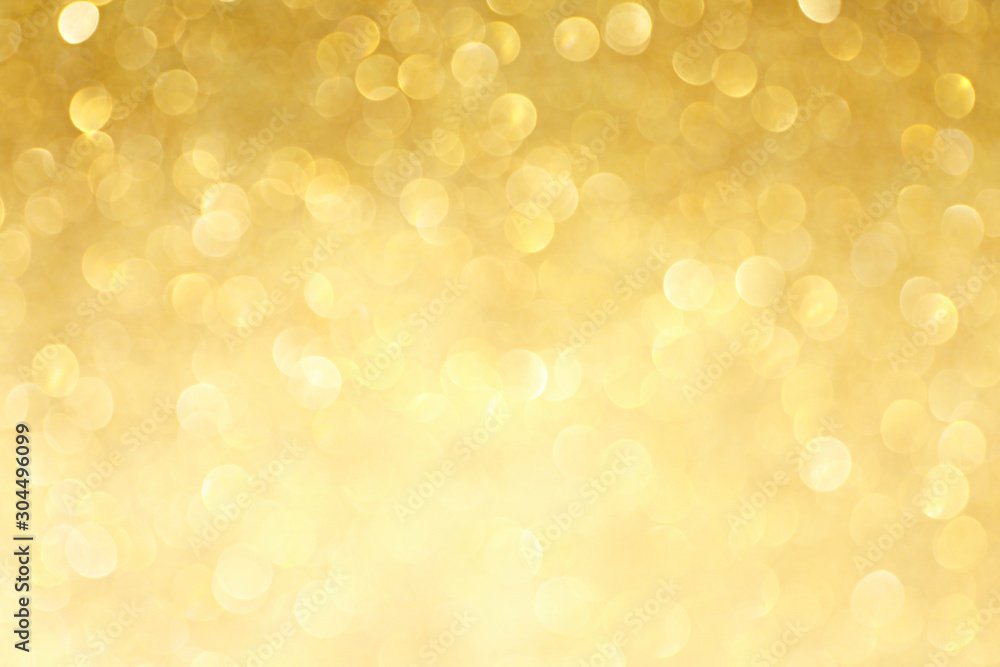 Golden sparkle glitters with bokeh effect and selectieve focus. Festive background with bright gold lights, champagne bubble. Christmas mood concept. Copy space, close up, texture, top view. - obrazy, fototapety, plakaty 