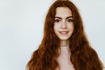 portrait of a girl with luxurious long thick thick wavy brown hair and a beautiful face