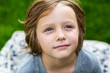 © Mint Images - Close up view of young boy looking up