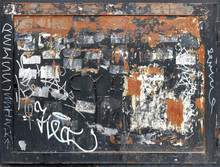 Rusty And Damaged Metal Square With Frame, Graffiti And Old Stickers Peeled Off