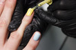 © Alisa - Manicure process. Close-up. Manicurist in black gloves. Gel Polish