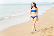 © AntonioDiaz - Happy Young Woman In Swimwear Walking On Beach