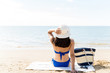 © AntonioDiaz - Woman Relaxing On Sea Shore At Beach