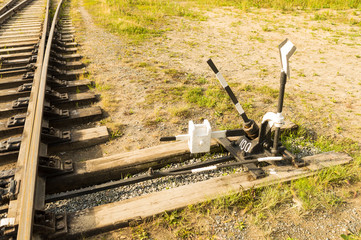 Mechanism for manual switching arrows of railway fork. Nature. Side view.