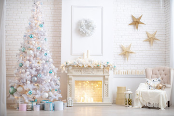 the interior of the living room in bright colors, decorated for Christmas.