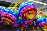 Fototapeta Tęcza - Bright glass rainbow colored Christmas balls, baubles hanging for sale. The concept of the holiday, Christmas, symbol of the rainbow