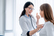 © InsideCreativeHouse - Female doctor examining young girl in cabinet using stethoscope