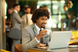 © bugarskipavle3 - Young afro american business siting in a cafe while work on a laptop