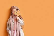 Fashionable Little Girl In Autumn Clothes On Color Background