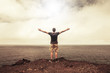 Success and freedom concept – grateful free man in front of bright sky
