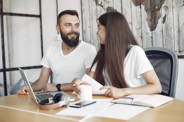 Wall Mural - Students create a new project. Couple working in a office