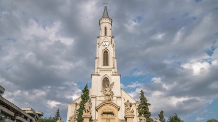 Wall Mural - Tilt up: Cluj-Napoca, Romania: St. Peter's Church timelapse with beautiful moving clouds. Timelapse of the St. Peter's Church in Cluj-Napoca, Romania. Church, cathedral time lapse in Cluj