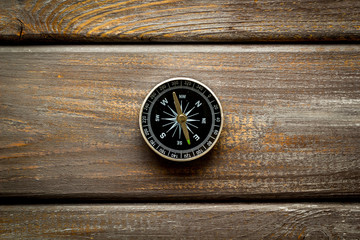 Wall Mural - Compass - small and stylish - on dark wooden background top view copy space