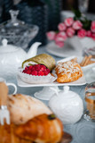 Fototapeta Tulipany - buns and cakes in a white plate