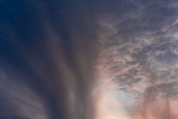 Wall Mural - Dramatic orange sky with clouds at sunset. It can be used as a background