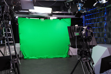 Modern video recording studio with professional equipment, focus on camera