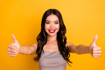 Sticker - Photo of cheerful positive cute pretty nice girlfriend smiling toothily expressing positive emotions on face showing two thumbs up isolated vivid color background