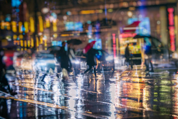 Wall Mural - crowd of people walking on night street in the city 