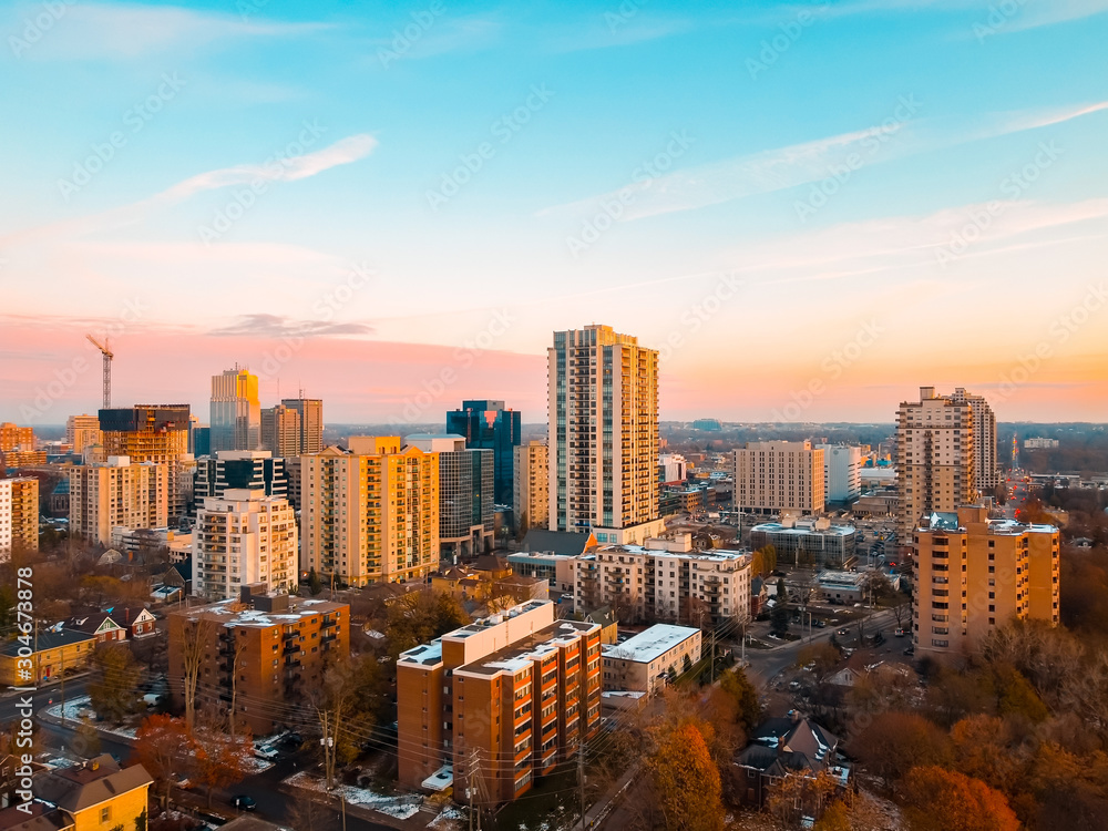 Aerial photo of the cityscape and downtown skyline in London, Ontario, Canada as the sun sets in late Autumn, November 2019. - obrazy, fototapety, plakaty 