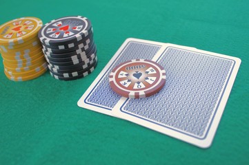 Cards and chips on a green table