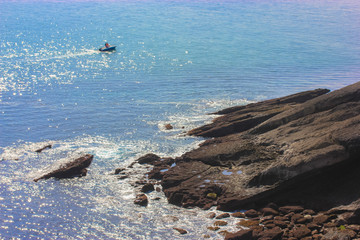 Fishermen in a boat in the Atlantic Ocean on the coast of Santander, Spain