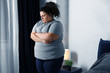 © New Africa - Overweight woman suffering from depression at home