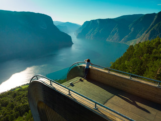 Sticker - Tourist enjoying fjord view on Stegastein viewpoint Norway