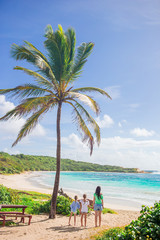 Canvas Print - Happy beautiful family on a tropical beach vacation