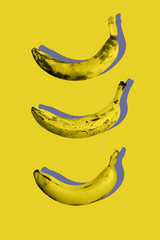 Photography minimal art collage of ugly ripe fruit bananas on yellow color background in trendy pop-art style.Top view flat lay isometric pattern.Modern design.Vertical orientation