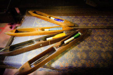 Old traditional hand made wooden shuttle used in weaving.