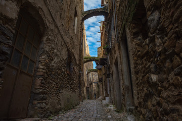 Sticker - The Italian city of ghost or the city of artists Bussano Viecha. Golden autumn, yellow leaves, blue sky and sun!