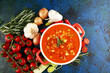 Minestrone soup in a bowl on a light table, top view. Italian soup with pasta and seasonal vegetables. Delicious vegetarian food concept.