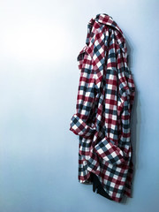 Plaid shirt hanging on a hook