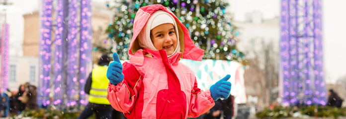 Wall Mural - little girl outdoors at christmas time