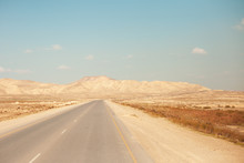 A Beautiful Photograph Of A Road In An Open Area.