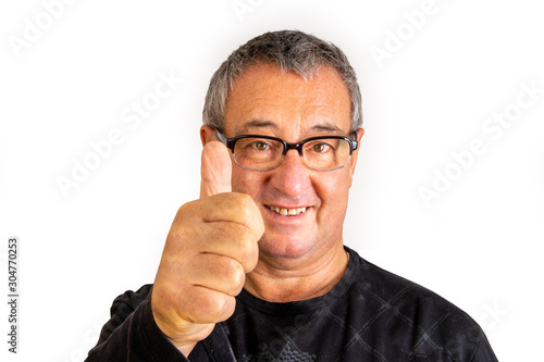 Cuadros en Lienzo Man with glasses holds thumb up for approval