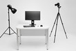 © prochkailo - Photographer working place in photo studio with lighting equipment. Camera on the tripod. PC computer on desk. Designer working place.