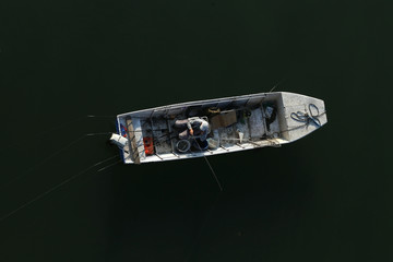 Fisherman in the boat from above