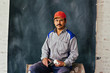© Carlos David - Studio portrait of construction worker