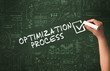 © ra2 studio - Hand drawing OPTIMIZATION PROCESS inscription with white chalk on blackboard, new business concept