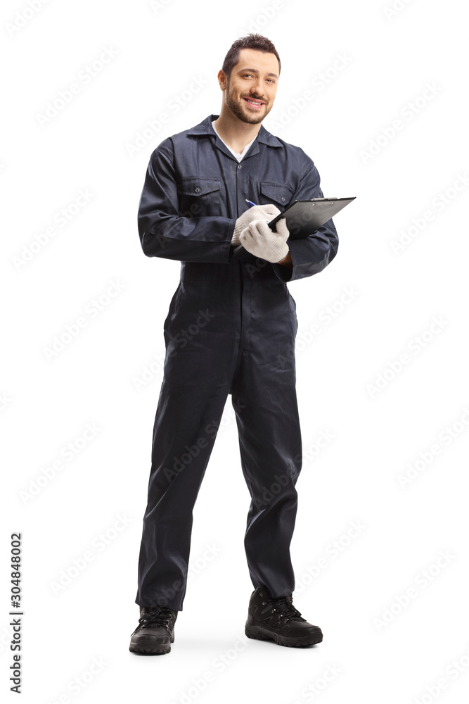 Automechanic standing with a clipboard