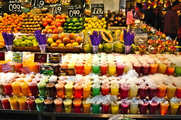 Ready to eat fruit salad in plastic container at La Boqueria Market in Las Rambas, Barcelona, Spain)