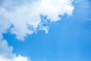  bottom view of blue sky with white clouds and sunshine