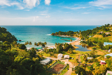 Beautiful tropical Barbados island. View of the golden beach with palms and crystal clear water. Perfect holidays background.