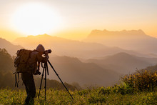 Nature Photographer Take Photos With Mirror Camera On Peak Of Mountain At Morning Sunrise