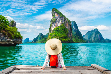 Wall Mural - Traveler woman looking amazed nature scenic landscape tropical island Phang-Nga bay Adventure lifestyle tourist travel Phuket Thailand summer holiday vacation  Tourism beautiful destination place Asia