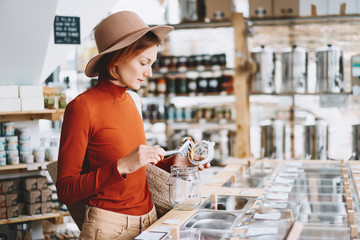 Woman buying products in plastic free grocery store