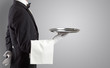 © ra2 studio - Waiter serving with white gloves and steel tray in an empty space