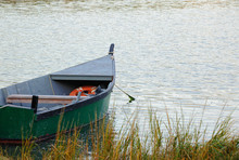 Old Wooden Boat In Autumn Mooed In Salt Pond On Cape Cod
